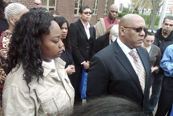 Tanya McDowell, left, stands with Connecticut NAACP Conference President Scott X. Exdaile, right, and other supporters outside state superior court in Norwalk, Conn., on April 27. McDowell, a homeless and single mother, pleaded not guilty&nbsp;to stealing nearly $16,000 worth of education for her son by enrolling the kindergartener in her baby sitter's school district.